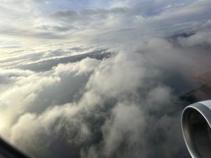 clouds in the sky with smoke coming out of it