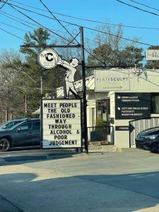 a sign on the side of the street